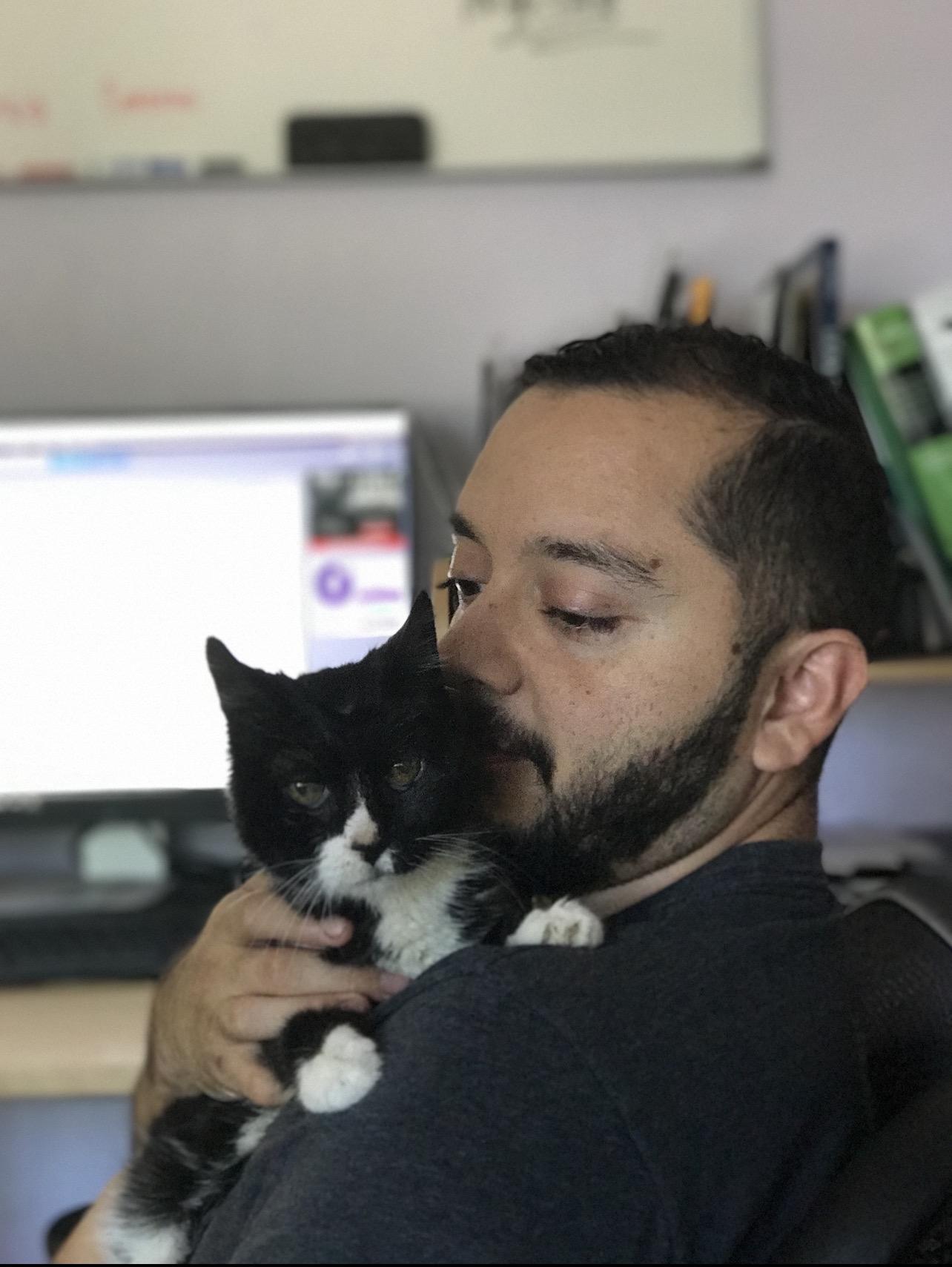 Max with a black and white senior cat